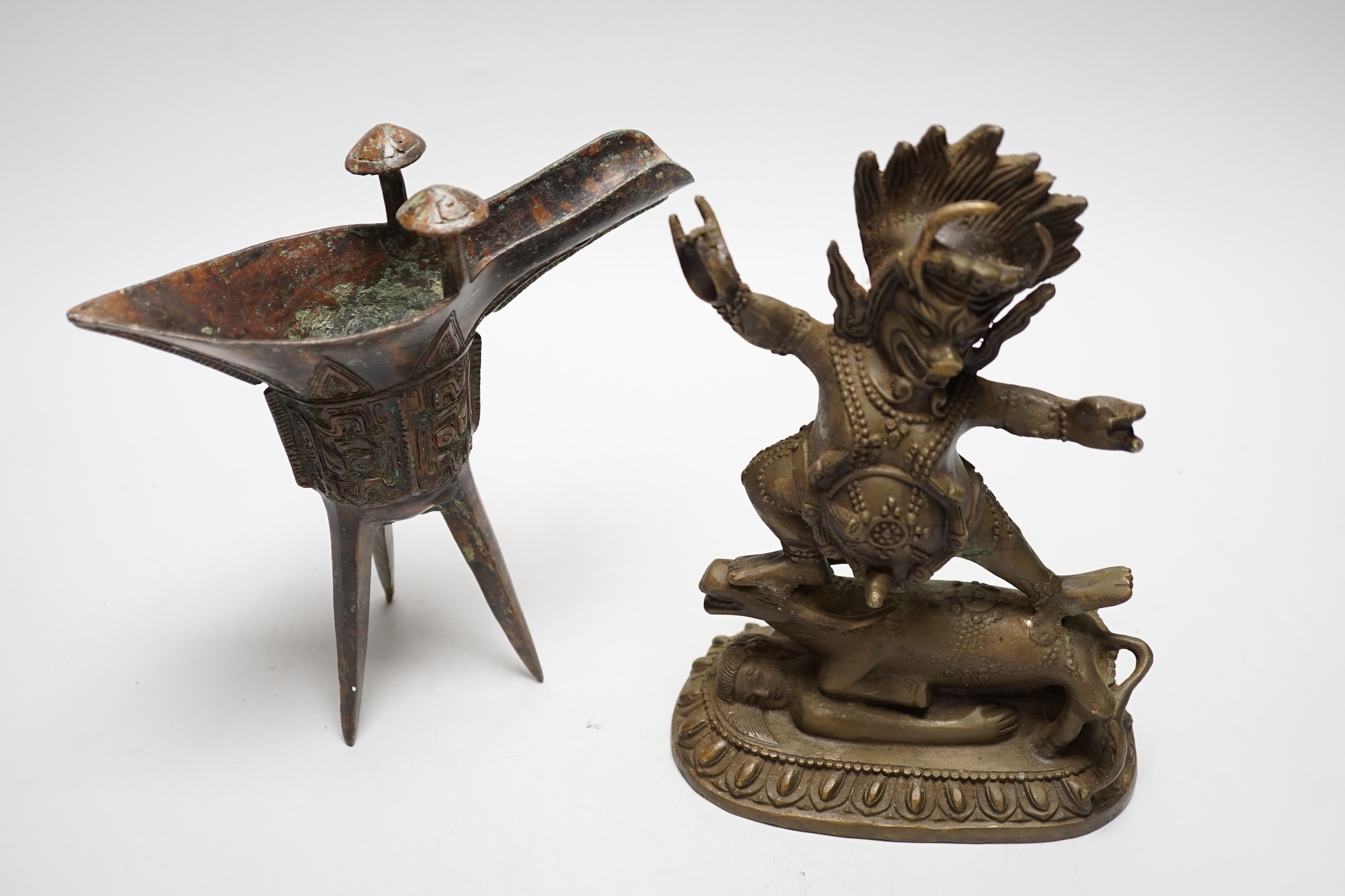 A Buddhist bronze figure and a bronze yi vessel, figure 22cm high